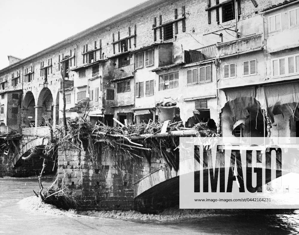 FLORENCE: FLOOD, 1966. Damage to goldsmith shops on the Ponte Vecchio and debris marking the high water line of the flood of the Arno River. Photograph