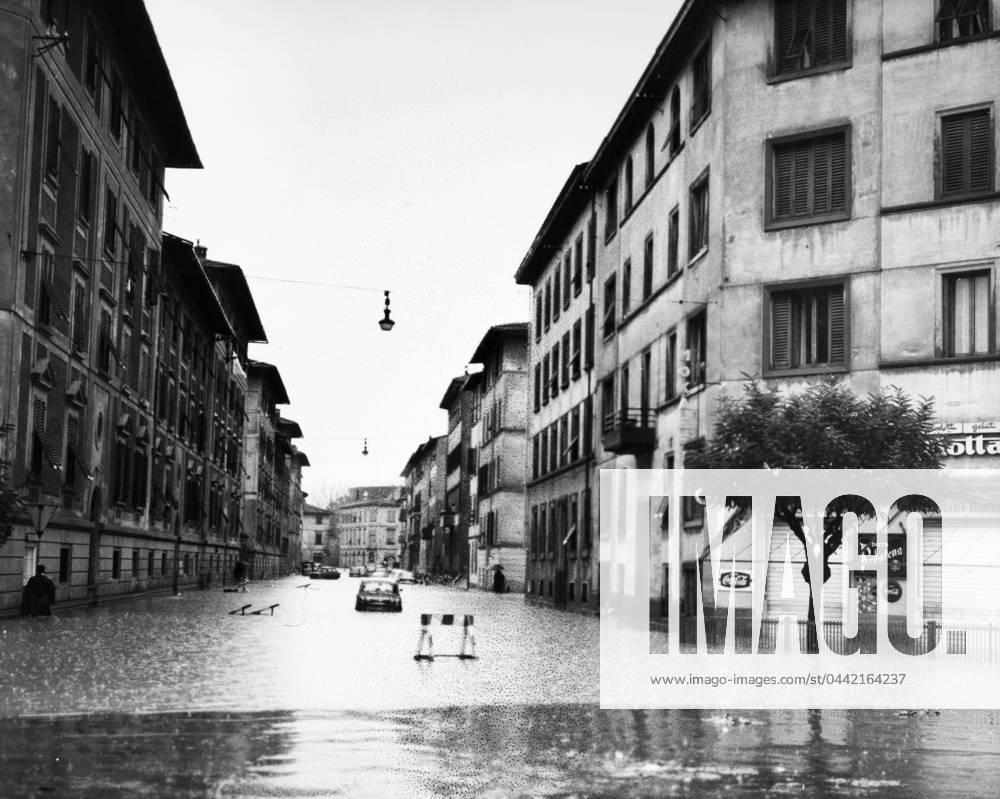 FLORENCE: FLOOD, 1966. Cars stranded in a street in Florence, Italy, during the flood of the Arno River. Photograph