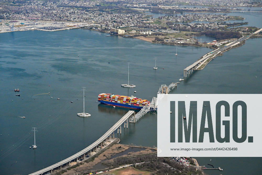 A damaged container ship rests next to a bridge pillar in the Patapsco River after crashing into and destroying the Francis Scott Key Bridge at the entrance to Baltimore harbor in Baltimore, Maryland, Tuesday, March 26, 2024. Several workers were atop the bridge and making repairs to the asphalt roadway when the structure collapsed. BAP20240326104 DAVIDxTULIS