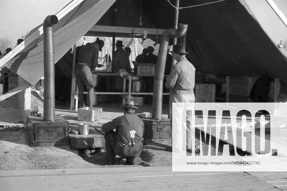 FLOOD REFUGEES, 1937. The kitchen tent at a flood refugee camp in Forrest City, Arkansas. Photograph by Walker Evans, February 1937.