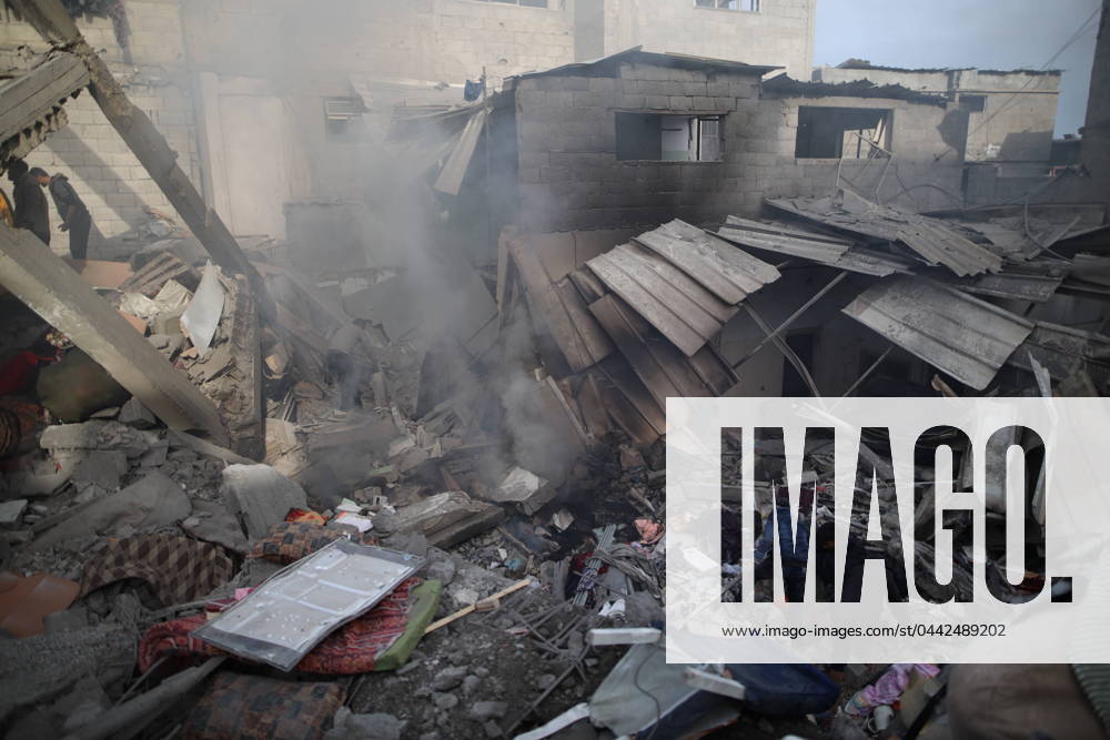 (240326) -- GAZA, March 26, 2024 -- People search among the rubble after an Israeli airstrike in Maghazi refugee camp, central Gaza Strip, on March 26, 2024. The Palestinian death toll in the Gaza Strip from ongoing Israeli attacks has risen to 32,414, the Hamas-run Health Ministry said in a press statement on Tuesday. MIDEAST-GAZA-MAGHAZI REFUGEE CAMP-ISRAELI AIRSTRIKE Dawood