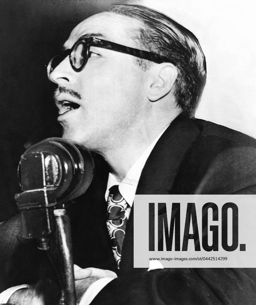DALTON TRUMBO (1905-1976). American screenwriter. Photographed testifying before the House Un-American Activities Committee, regarding the influence of Communism in Hollywood, October 1947.