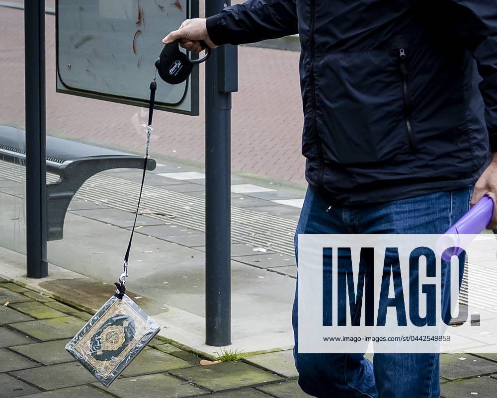 ARNHEM - Pegida leader Edwin Wagensveld arrives at the Arnhem court while dragging a Quran on a dog leash on the ground. The Pegida leader was arrested in court for dragging the Koran, violating the emergency order that was previously imposed on him. ANP SEM VAN DER WAL netherlands out - belgium out