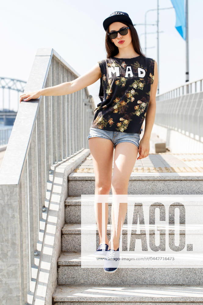 Street, outdoor. Attractive teen in a cap , model released