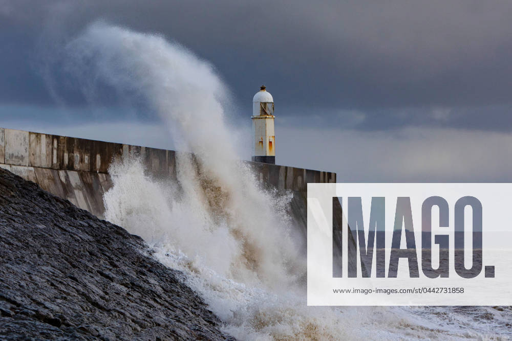 KW13 At Porthcawl breakwater, Wales, on the incoming high tide during Storm Nelson, it wasn?t only waves that were crashing over the lighthouse, but rainbows too. As the evening sunlight was catching the sea spray, rainbows were revealed, seemingly to arch over the lighthouse and breakwater. Where: Porthcawl, Wales, United Kingdom When: 28 Mar 2024 Credit: Joann Randles Cover Images . NOT FOR USE BY NEWSPAPERS BASED IN THE UK.
