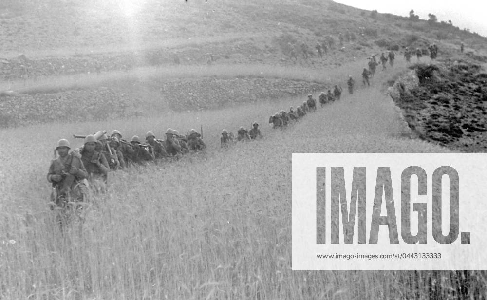 A column of Italian soldiers moving towards the town of Pina on July 16, 1938, in the course of the action known as Del Levante , during the Spanish civil war. The men, carrying their equipment, are crossing a sunlit field of wheat (b w photo) 1250024 A column of Italian soldiers moving towards the town of Pina on July 16, 1938, in the course of the action known as Del Levante , during the Spanish civil war. The men, carrying their equipment, are crossing a sunlit field of wheat (b w photo) by Unknown photographer, (20th century); (add.info.: Unidentified Author Spain); Fratelli Alinari Museum Collections, Florence, Italy.