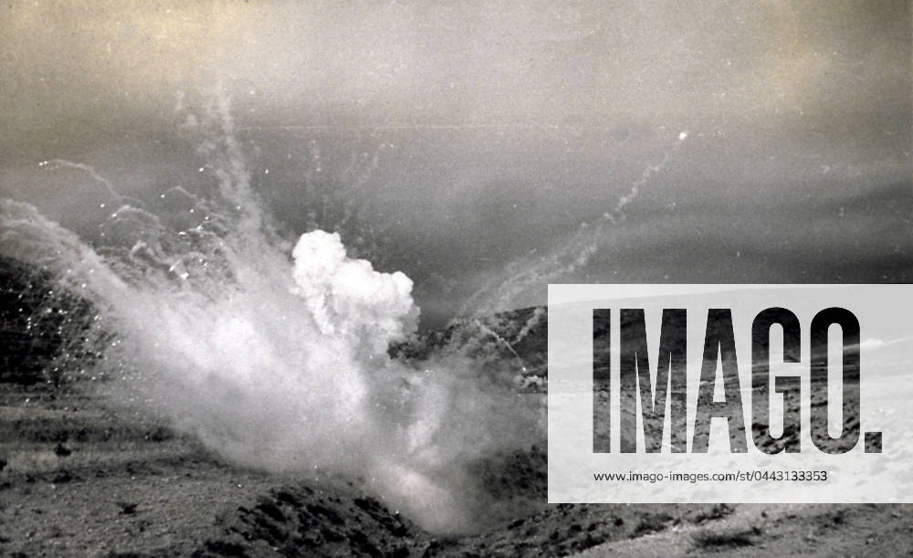 Explosion of an incendiary bomb during a drill in the territory of Teruel on July 15, 1939, during a Spanish civil war action known as Del Levante . Smoke, gas and rubble that resulted from the violent reaction of the bomb can be seen (b w photo) 1250035 Explosion of an incendiary bomb during a drill in the territory of Teruel on July 15, 1939, during a Spanish civil war action known as Del Levante . Smoke, gas and rubble that resulted from the violent reaction of the bomb can be seen (b w photo) by Unknown photographer, (20th century); (add.info.: Unidentified Author Spain); Fratelli Alinari Museum Collections, Florence, Italy.