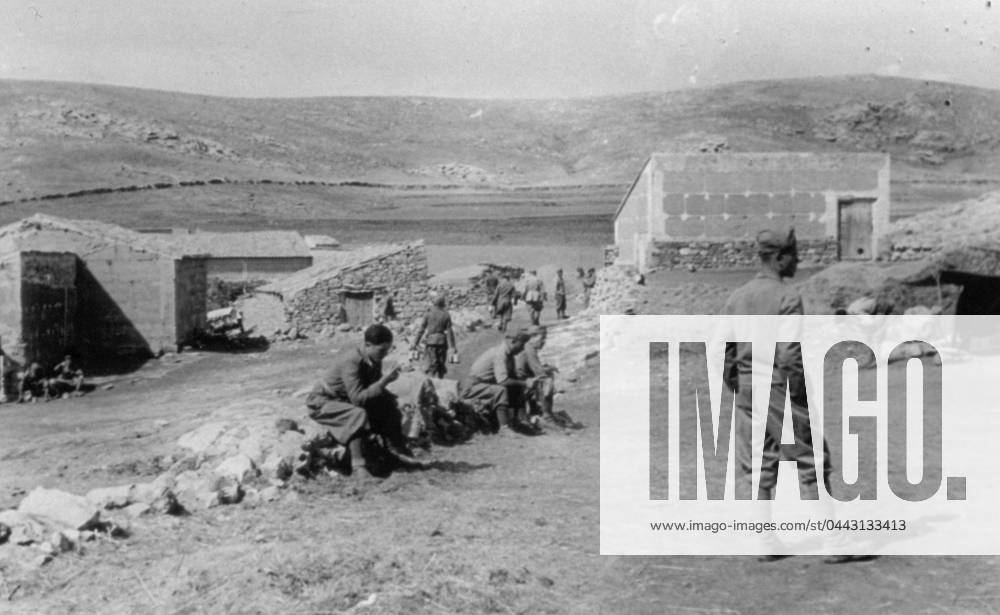 Italian soldiers of the Third Company photographed resting during their temporary lodgings in farm buildings in the course of the Spanish civil war, 07 1938 (b w photo) 1250079 Italian soldiers of the Third Company photographed resting during their temporary lodgings in farm buildings in the course of the Spanish civil war, 07 1938 (b w photo) by Unknown photographer, (20th century); (add.info.: Unidentified Author Spain); Fratelli Alinari Museum Collections, Florence, Italy.