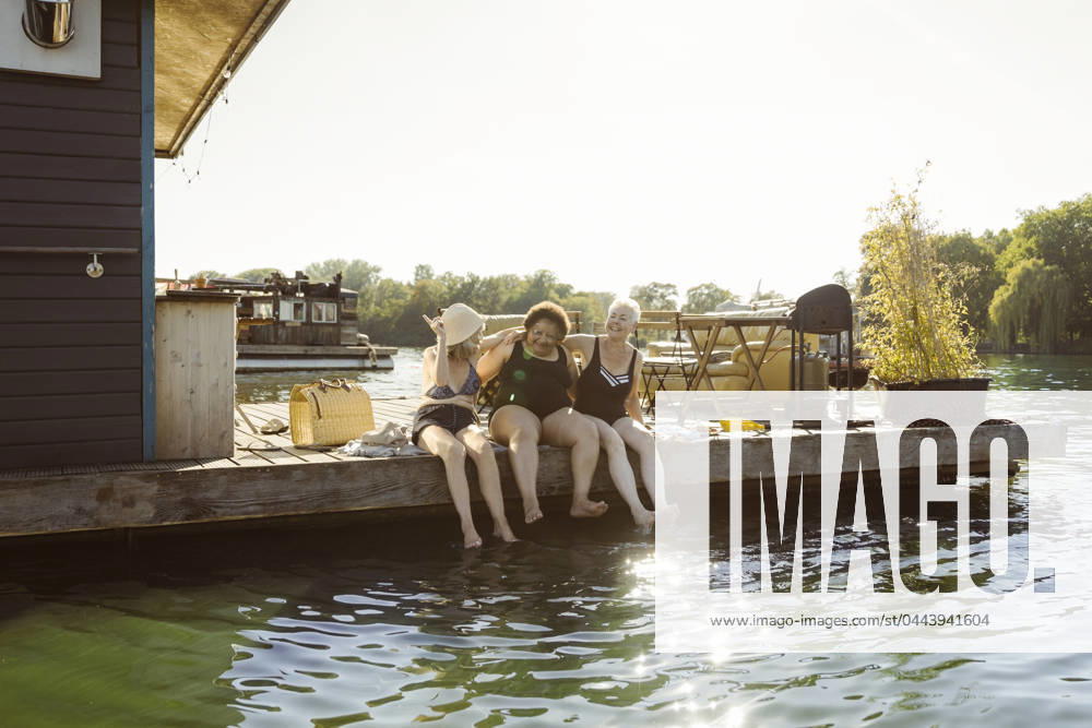 Happy senior female friends enjoying together during vacation on houseboat Germany, Berlin, model released, property released