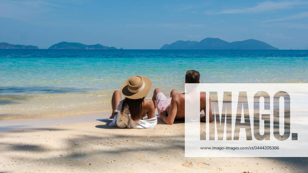 Koh Wai Island Thailand tropical Island near Koh Chang, couple of men and woman on the beach Koh Wai Island Trat Thailand is a tinny tropical Island near Koh Chang. a young couple of men and women on a tropical beach during a luxury vacation in Thailand relaxing on the beach ,model released, Symbolfoto