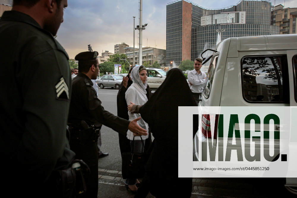 Iranian Morality Police Comeback to Streets Iranian morality police officers detain a woman on the street during a patrol to enforce the countrys compulsory hijab laws in Tehran on Sunday, July 2005. Tehran Tehran Iran