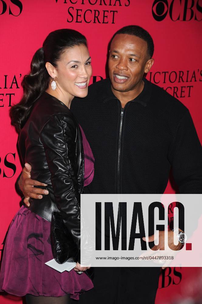 2009 Victoria s Secret Fashion Show Pink Carpet Dr Dre and guest posing for photographers at the 2009 Victoria s Secret Fashion Show Pink Carpet Arrivals on November 19, 2009 at the Lexington Avenue Armory in New York City. Picture by,