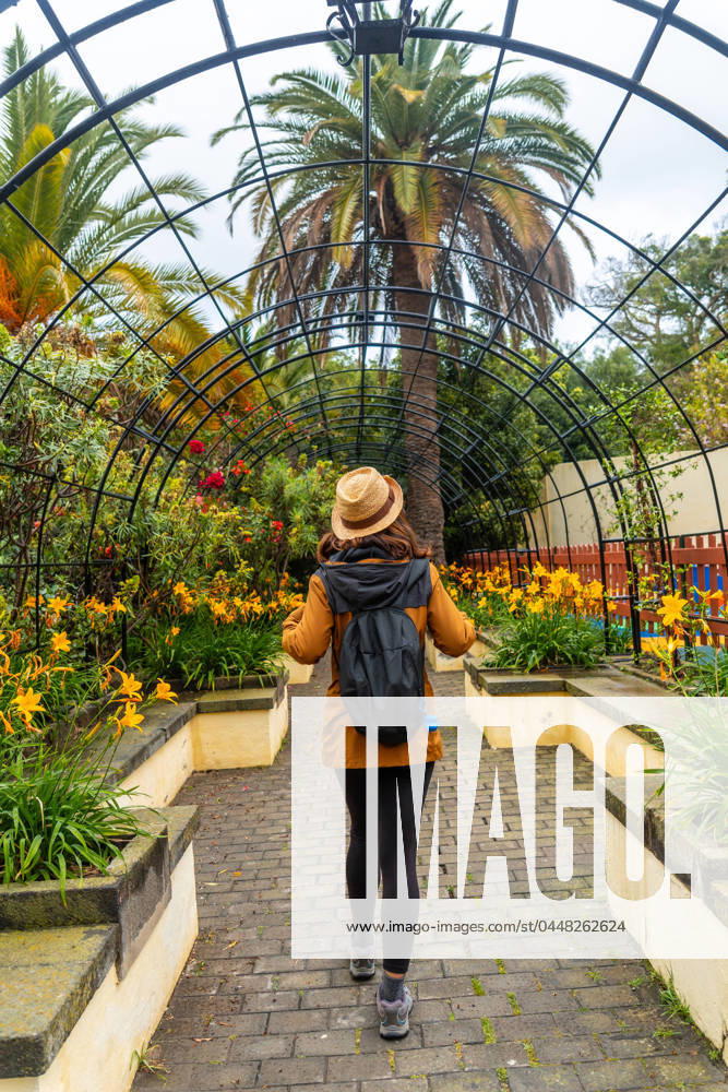 A Woman Walking Through a Beautiful Botanical garden, a Sustainable Tourism Concept in Arucas, Gran Canaria Spain