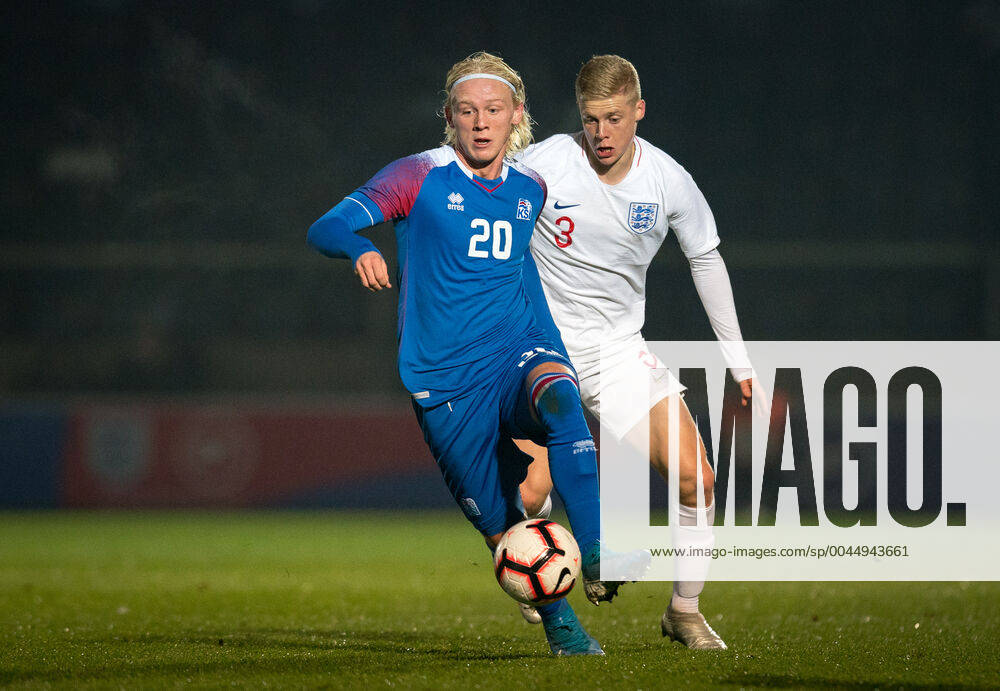 Kolbeinn Birgir Finnsson (Borussia Dortmund II) of Iceland U21, U 21 & Alex Cochrane (Brighton & Hove Albion) of England U20 during the international match, Länderspiel, Nationalmannschaft between England U20 and Iceland U21 at Adams Park, High Wycombe, England on 19 November 2019.