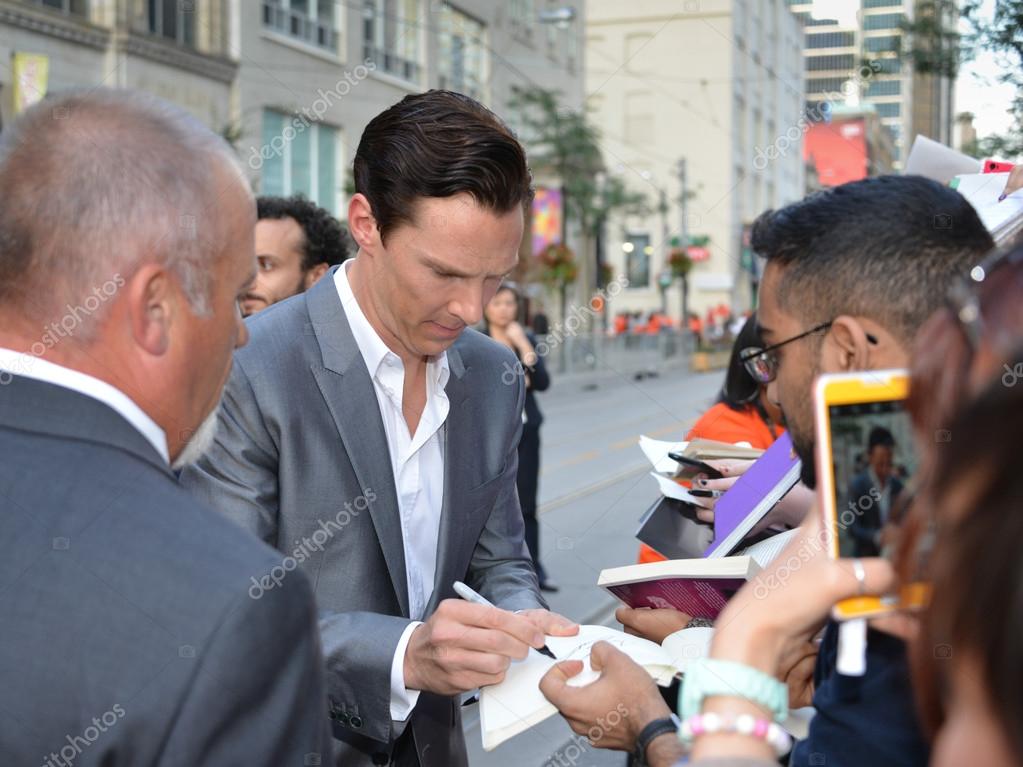 Actor Benedict Cumberbatch signs autographs at the Toronto International Film Festival for his new film 12 Years a Slave on September 6, 2013.
