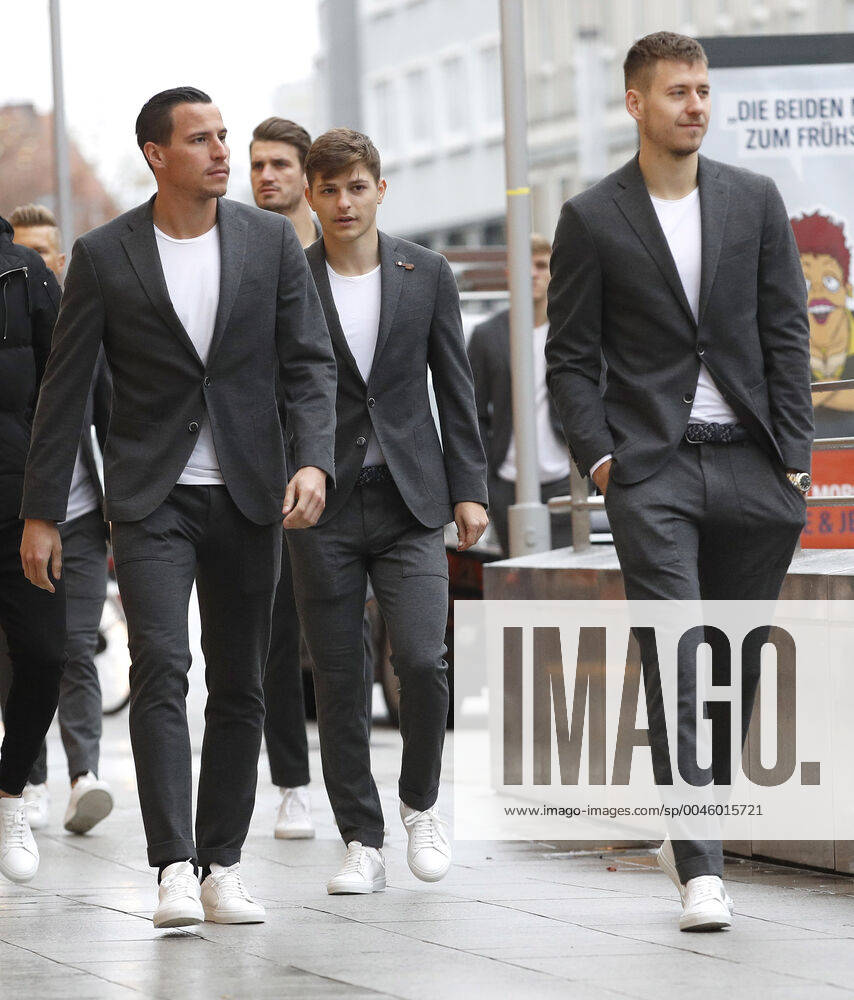 City centre, Hanover, Sponsor visit of the team of Hanover 96 at the mens outfitter Eckerle, in the picture Edgar Prib 7, Hanover , Hendrik Weydandt 26, Hanover , Florent Muslija 35, Hanover and Waldemar Anton 31, Hanover in their suit on the way to the shop Sponsor visit of Hanover 96