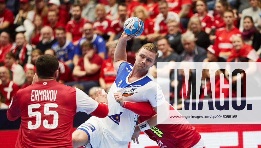 Iceland s Aron Palmarsson against Russia s Aleksandr Ermakov during the Men s European Handball Championship, preliminary round Group E, match between Iceland and Russia at Malmo Arena, Sweden, on Monday Jan 13, 2020 Photo Andreas Hillergren TT code10600 Malmo Sweden