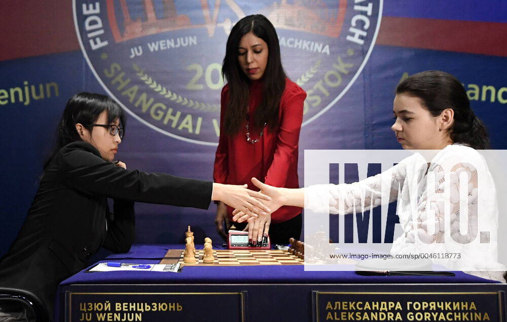 KW03 VLADIVOSTOK, RUSSIA - JANUARY 16, 2020: China s Ju Wenjun (L) and Russia s Aleksandra Goryachkina shake hands during the second part of the 2020 Women s World Chess Championship title match at the Blue Hall at Far Eastern Federal University (FEFU) on Russky Island. Yuri Smityuk TASS TS0CA4A7