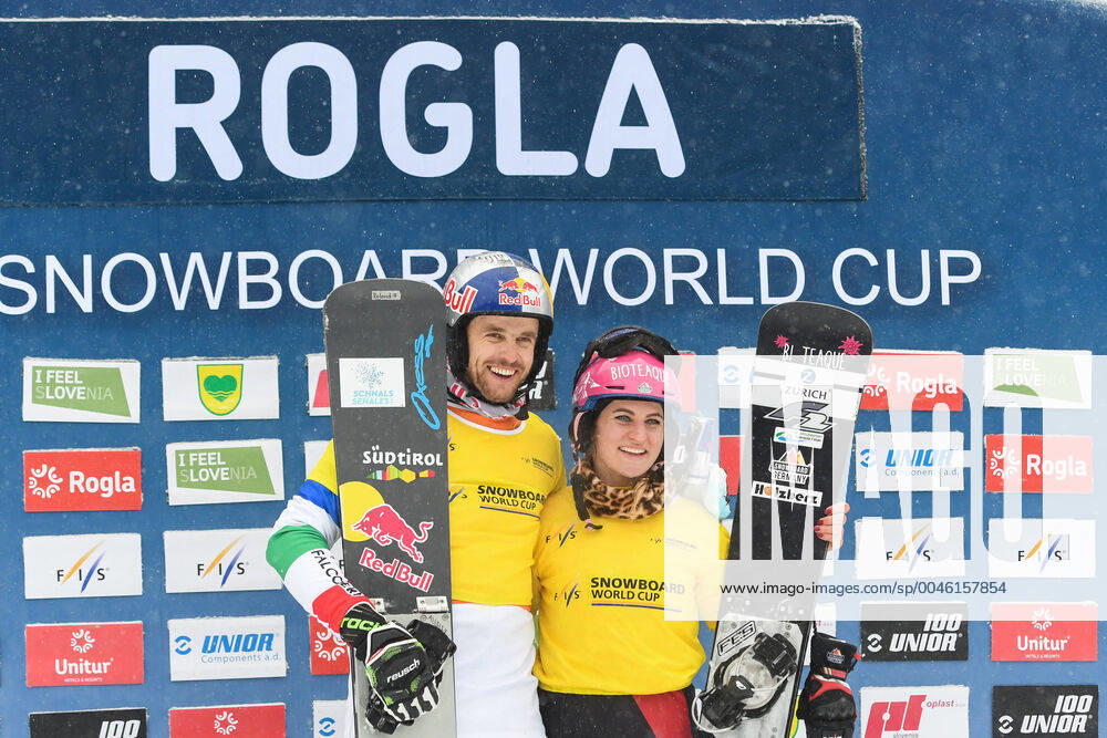 World Cup leaders Roland Fischnaller of Italy and Ramona Hofmeister of Germany pose on the podium after the FIS World cup Parallel Giant Slalom in Rogla. FIS World cup Parallel Giant Slalom in Rogla, Slovenia - 18 Jan 2020 - ZUMAs197 20200118_zaa_s197_148