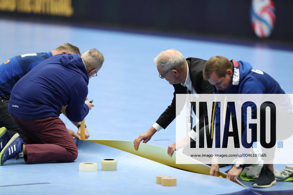 Officials mend the pitch during the break in the Men s European Handball Championship main round Group 2 match between Slovenia and Hungary at Malmo Arena, Friday Jan 19, 2020 Photo Andreas Hillergren TT code 10600 Malmo Sweden HANDBALL