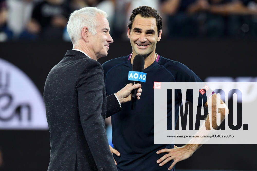 AUSTRALIAN OPEN DAY 3, Roger Federer of Switzerland (right) is interviewed by John McEnroe (left) after winning his second round match against Filip Krajinovic of Serbia on day three of the Australian Open tennis tournament at Rod Laver Arena in Melbourne, Wednesday, January 22, 2020. ( NO ARCHIVING, , NO USE IN BOOKS WITHOUT CONSENT MELBOURNE VIC AUSTRALIA