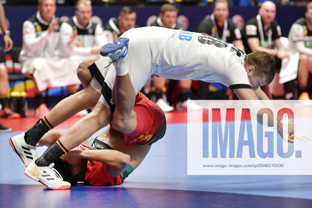 Portugal s Andre Gomes bottom and Germany s Fabian Bohm fall during the match for fifth sixth place between Germany and Portugal during the Men s European Handball Championship in Stockholm, Sweden, on Jan 25, 2020 Stockholm Sverige