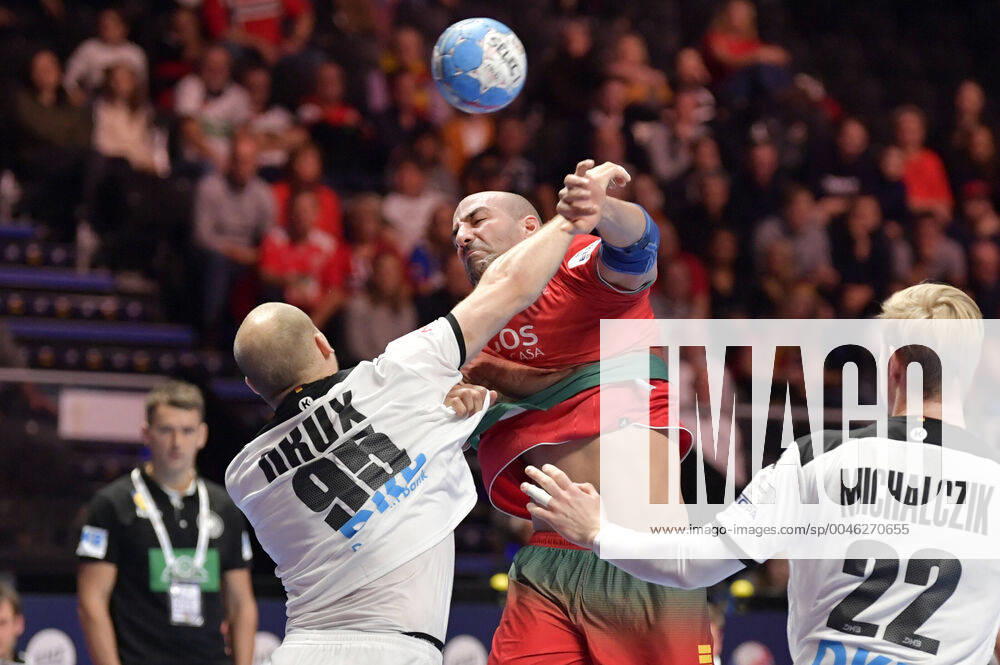 Portugal s Joao Miguel Ferraz in action againts Germany s Paul Drux and Marian Michalczik during the match for fifth sixth place between Germany and Portugal during the Men s European Handball Championship in Stockholm, Sweden, on Jan 25, 2020 Stockholm Sverige