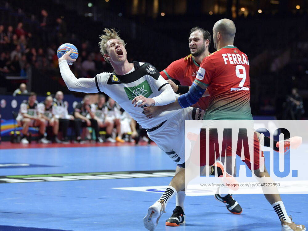 Germany s Marian Michalczik L scores during the last few minutes of the match for fifth sixth place between Germany and Portugal during the Men s European Handball Championship in Stockholm, Sweden, on Jan 25, 2020 Stockholm Sverige