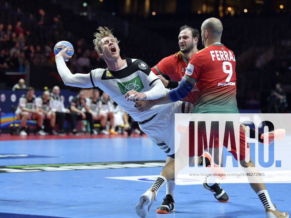 Germany s Marian Michalczik L scores during the last few minutes of the match for fifth sixth place between Germany and Portugal during the Men s European Handball Championship in Stockholm, Sweden, on Jan 25, 2020 Stockholm Sverige