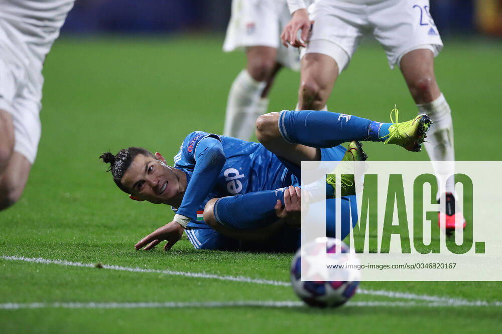 Juventus s Portuguese striker Cristiano Ronaldo holds his ankle after being fouled during the UEFA Champions League match at the Groupama Stadium, Lyon. Picture date: 26th February 2020. Picture credit should read: Jonathan Moscrop Sportimage . SPI-0491-0022