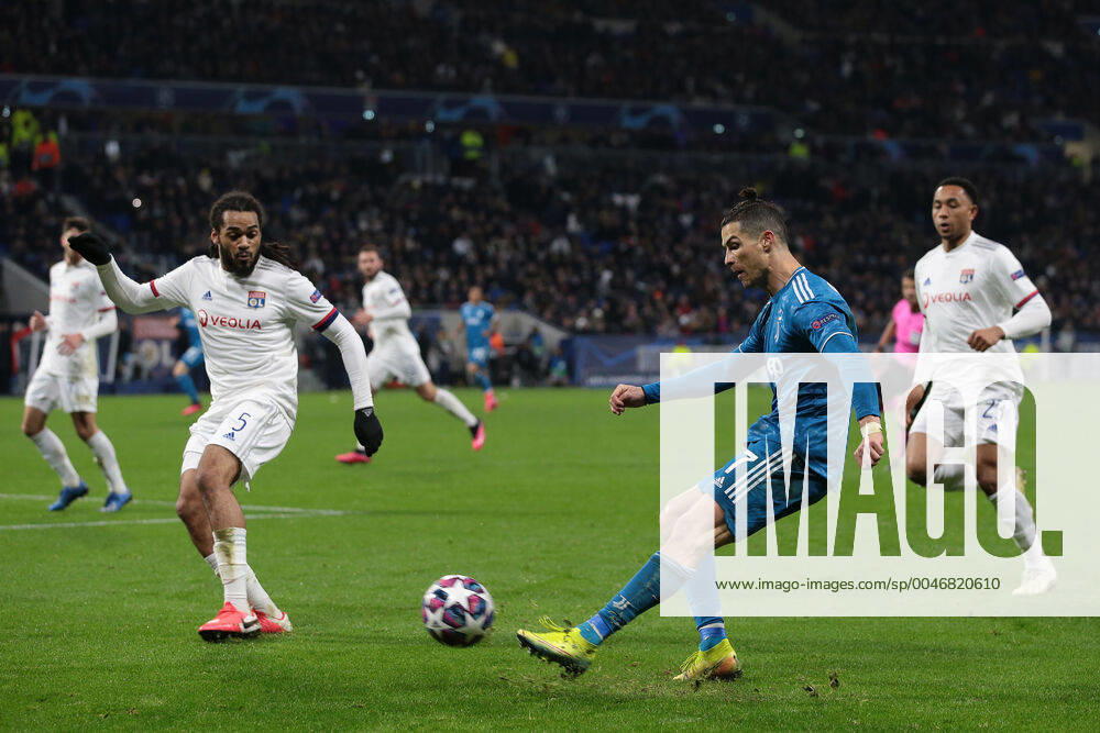 Juventus s Portuguese striker Cristiano Ronaldo crosses the ball as Lyon s Belgian defender Jason Denayer closes him down during the UEFA Champions League match at the Groupama Stadium, Lyon. Picture date: 26th February 2020. Picture credit should read: Jonathan Moscrop Sportimage . SPI-0491-0062