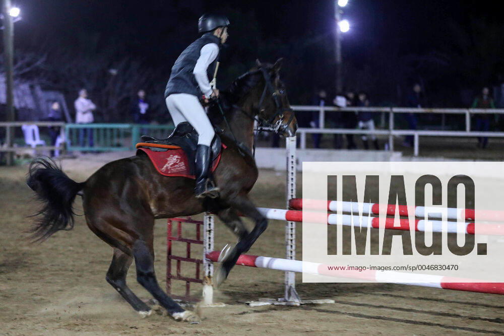 Gaza City, Gaza Strip, Palestinian Territory: A Palestinian horse rider on his horse jumps over a barrier during the first championship in jump barriers for the year 2020, on February 27, 2020 Middle East News - February 27, 2020 - ZUMAap3_ 97337384st