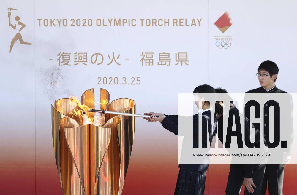 KW13 Olympic flame in northeastern Japan A schoolgirl lights the Tokyo Olympic flame in Iwaki, Fukushima Prefecture, on March 25, 2020. The Olympics torch relay, initially set to start on March 26 from northeastern Japan areas hit hard by the March 2011 earthquake-tsunami disaster, was canceled with the games postponed for about one year.