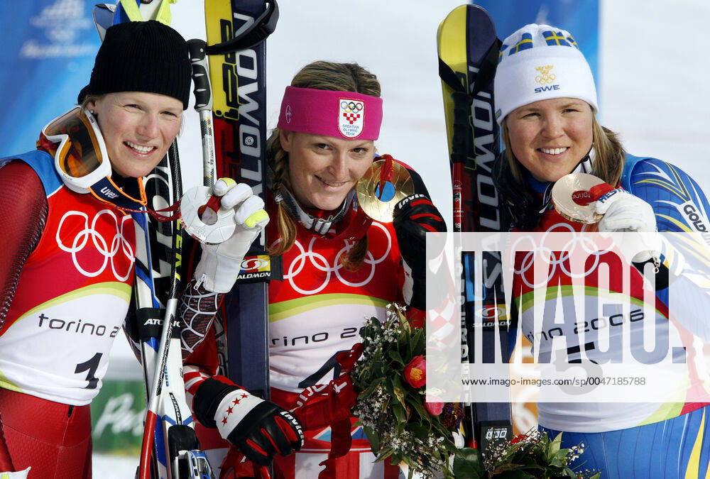 Winter Olympics 2006, Alpine Skiing Gold medalist Janica Kostelic of Croatia is flanked by silver medalist Marlies Schild of Austria and bronze medalist Anja Parson of Sweden after womens alpine combination at The Winter Olympic Games on February 18, 2006 in Turin, Italy BILDBYRAN,