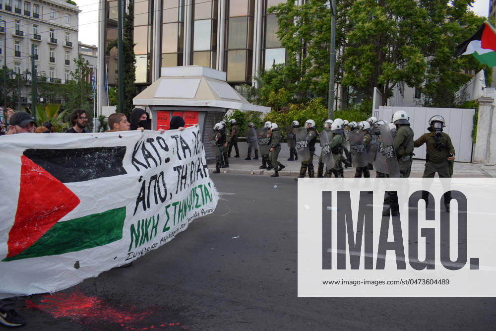 Greece: Pro-Palestinian Protest in Athens Protesters with banner march chanting slogans at Riot police during a pro-Palestinian demonstration against Israeli actions in Rafah. Athens Greece