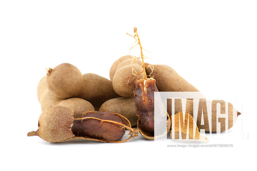 Tamarind whole and cracked open on white background Tamarind fruits, whole and cracked open isolated on white background (Tamarindus indica)