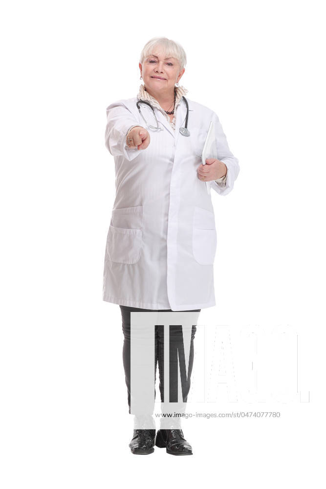 Full length of smiling woman doctor standing and using tablet Full length of smiling woman doctor standing and using tablet over white background