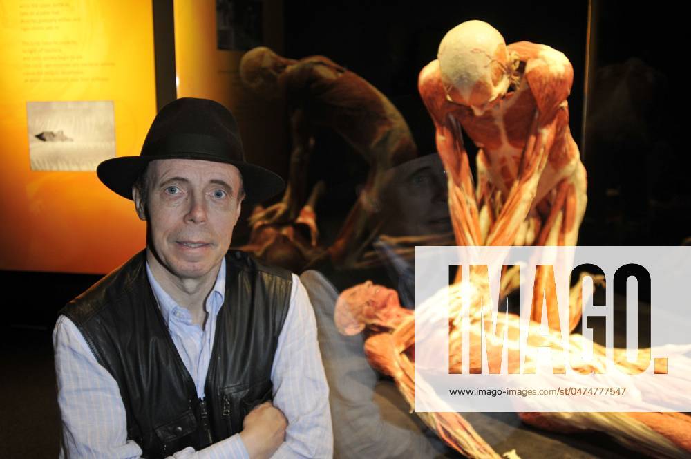 Body Worlds & the Mirror of Time exhibition DR. GUNTHER VON HAGENS .Press conference for the new sex plastinates which is part of the Body Worlds & the Mirror of Time exhibition at the O2 Arena, Greenwich, south-east London, England..June 23rd, 2009.bodyworks body works full length muscles internal organs flesh muscle skin models bone black hat blue shirt waistcoat hands cpr cardiopulmonary resuscitation gesture.CAP PL.Phil Loftus . London Great Britain