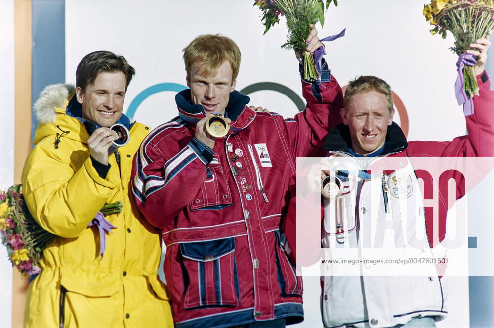 Winter Olympics 1998, Cross Country Skiing: Gold medalist Bjorn Daehlie of Norway is flanked by silver medalist Niklas Jonsson of Sweden (L) and bronze medalist Christian Hoffmann of Austria after 50 km freestyle at The Winter Olympic Games, Olympische Spiele, Olympia, OS on February 22, 1998 in Nagano, Japan. BILDBYRAN