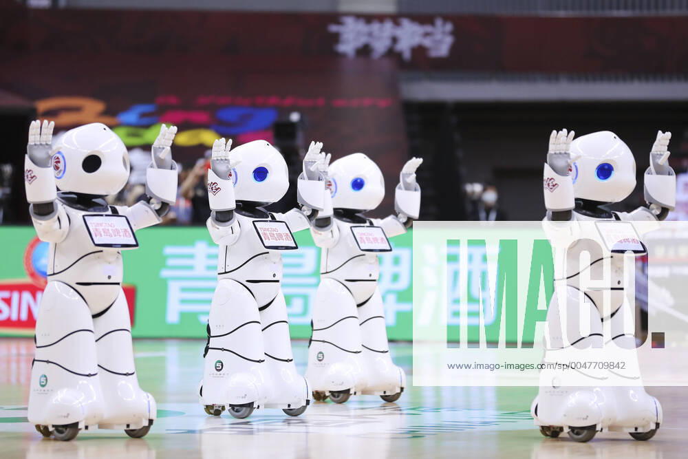 KW31 QINGDAO, CHINA - JULY 31: Robots dance during 2019 2020 Chinese Basketball Association (CBA) League match between Zhejiang Lions and Fujian Sturgeons at Guoxin Gymnasium on July 31, 2020 in Qingdao, Shandong Province of China.