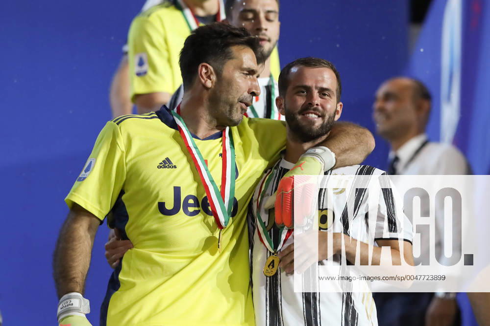 Gianluigi Buffon laughs with Miralem Pjanic of Juventus as they walk down from the terrace following the trophy presentation after the Serie A match at Allianz Stadium, Turin. Picture date: 1st August 2020. Picture credit should read: Jonathan Moscrop Sportimage . SPI-0619-0042