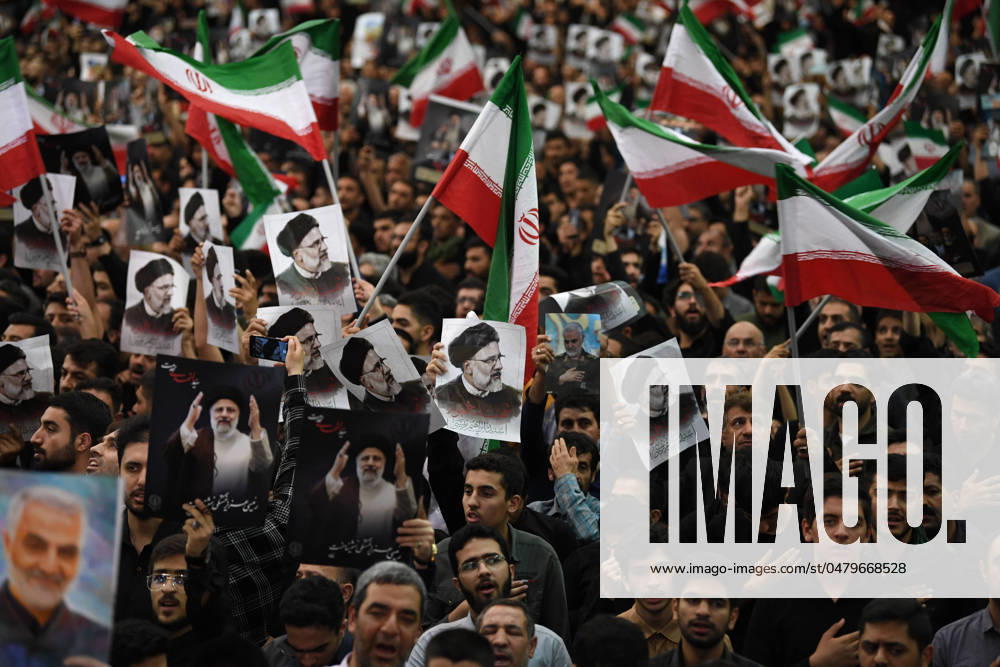(240522) -- BEIJING, May 22, 2024 -- People attend a farewell ceremony held for Iran s late President Ebrahim Raisi, late Foreign Minister Hossein Amir-Abdollahian and others in Tehran, Iran, May 21, 2024. People in Tehran on Tuesday attended, in large numbers, a farewell ceremony held for Iran s late President Ebrahim Raisi, late Foreign Minister Hossein Amir-Abdollahian and others after their bodies were transferred from the northwestern city of Tabriz to the capital city. Shadati) XINHUA PHOTOS OF THE DAY ShaxDati