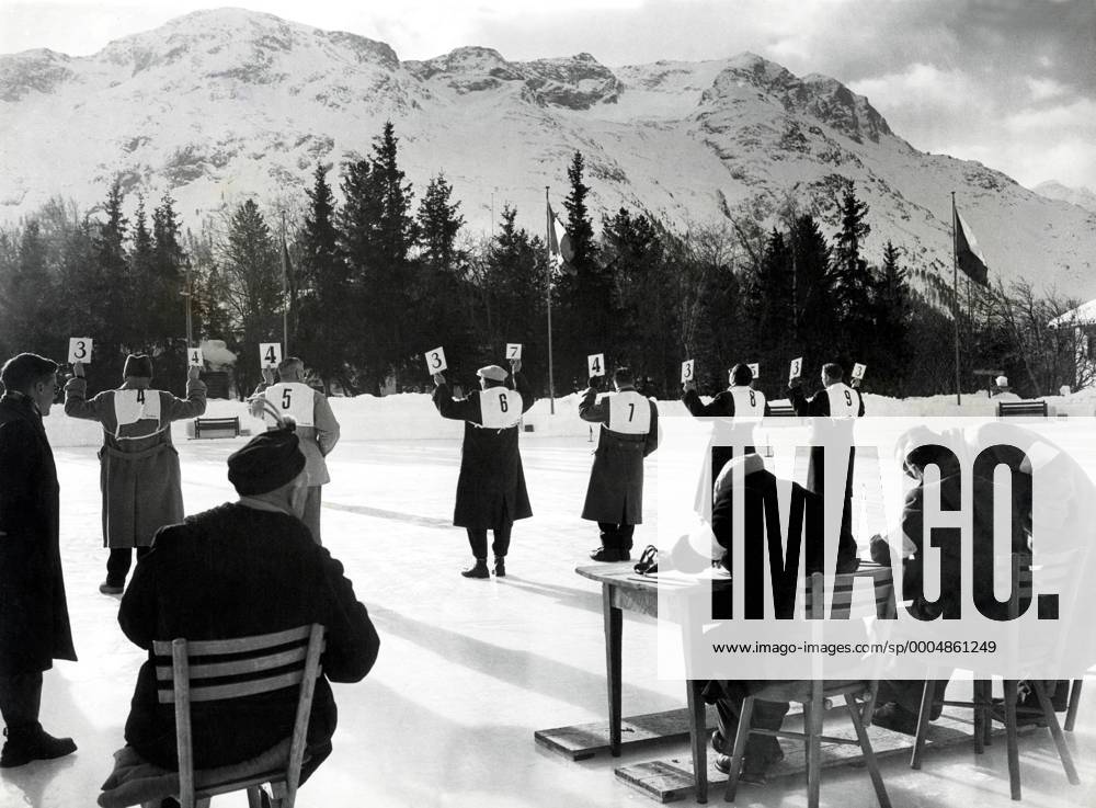 St. Moritz, ; Judges hold up the score cards while judging in the Women s Singles Skating Championships during the 1948 St. Moritz Winter Olympics. - ZUMAk09