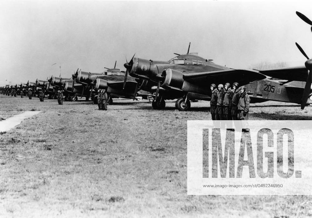 Savoia Marchetti SM-79 A Line of Savoia Marchetti Sm-79 Bomber with Flight Crew Standing in Front Date: 1930s