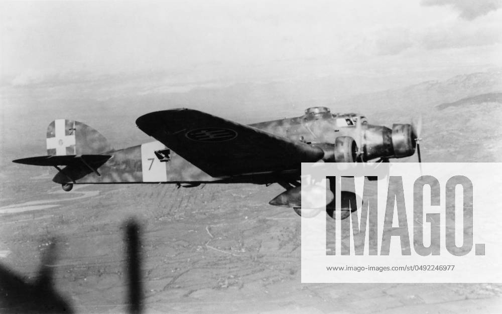 Savoia Marchetti SM-81 A Savoia Marchetti Sm-81 Bomber Flying over Buildings During the Spanish Civil War Date: 1930s