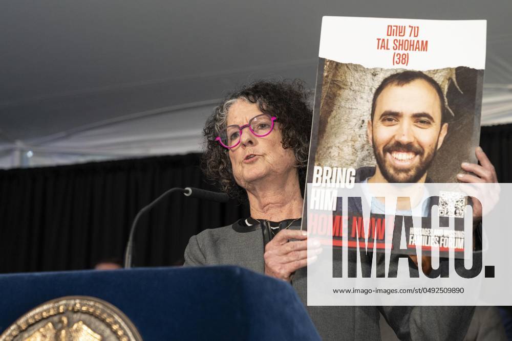 Shoshan Haran, who was kidnapped to Gaza along with her daughter, son-in-law, and their two children, and was released after 50 days speaks while holding poster with face of her son-in-law reception celebrating Jewish Heritage at Gracie Mansion in New York on May 29, 2024 New York United States - ZUMAr339 20240529_znp_r339_015