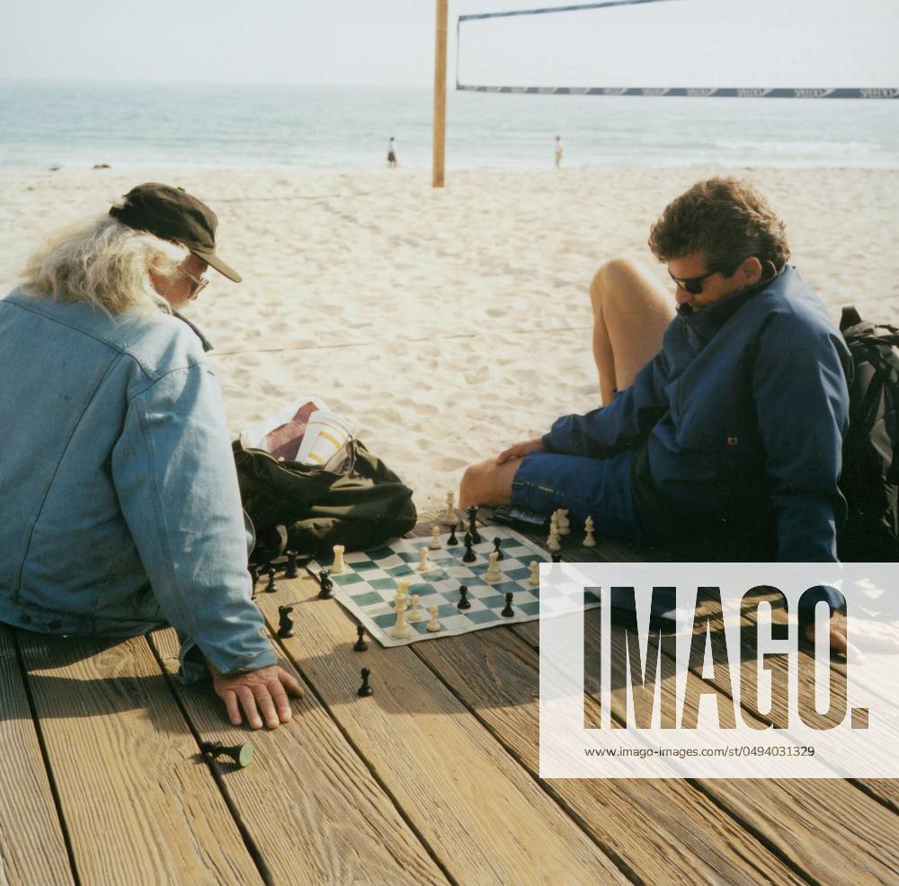 Two men playing chess on the beach, USA Two men playing chess on the beach, USA,