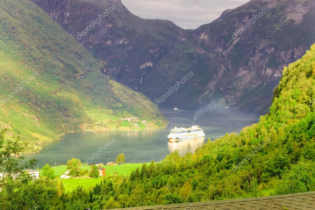 GEIRANGER, NORWAY-AUGUST 27: Cruise ship in Geiranger fjord, Gieranger, Norway on August 27, 2011. The AIDAluna belongs to the AIDA cruises company. It is 252 m long