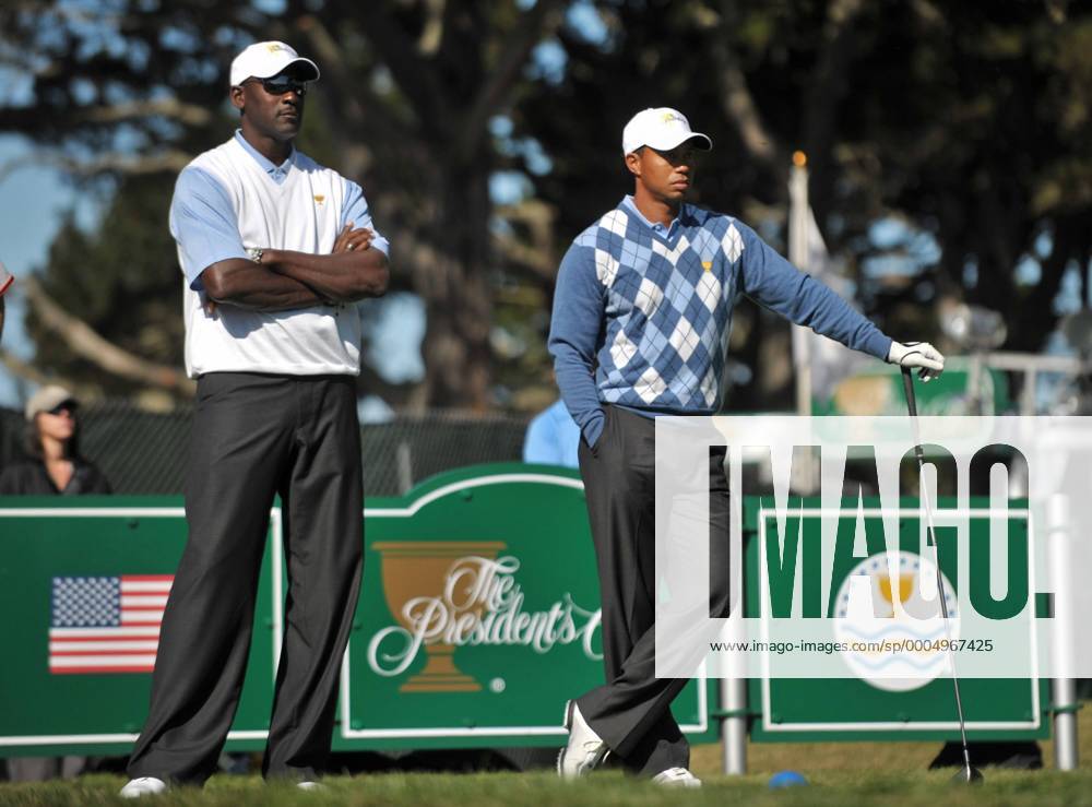 Tiger Woods (R) stands next to basketball legend Michael Jordan (both USA) as he waits to hit off of the 15th tee during a practice round prior to the start of The Presidents Cup in San Francisco, California - SFP20091007301 o00 The President s
