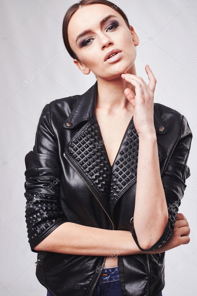 Fashion style girl portrait. Beautiful fashion woman with professional styling, hairdress and makeup. model released